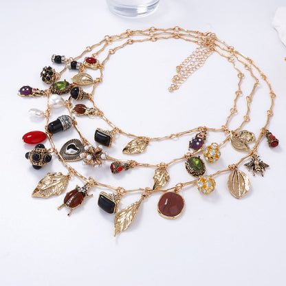 Vintage-Inspired Layered Pendant Necklace Featuring Unique Insect, Leaf, Heart, and Geometric Designs - Perfect for Adding a Touch of Bohemian Charm to Any Outfit