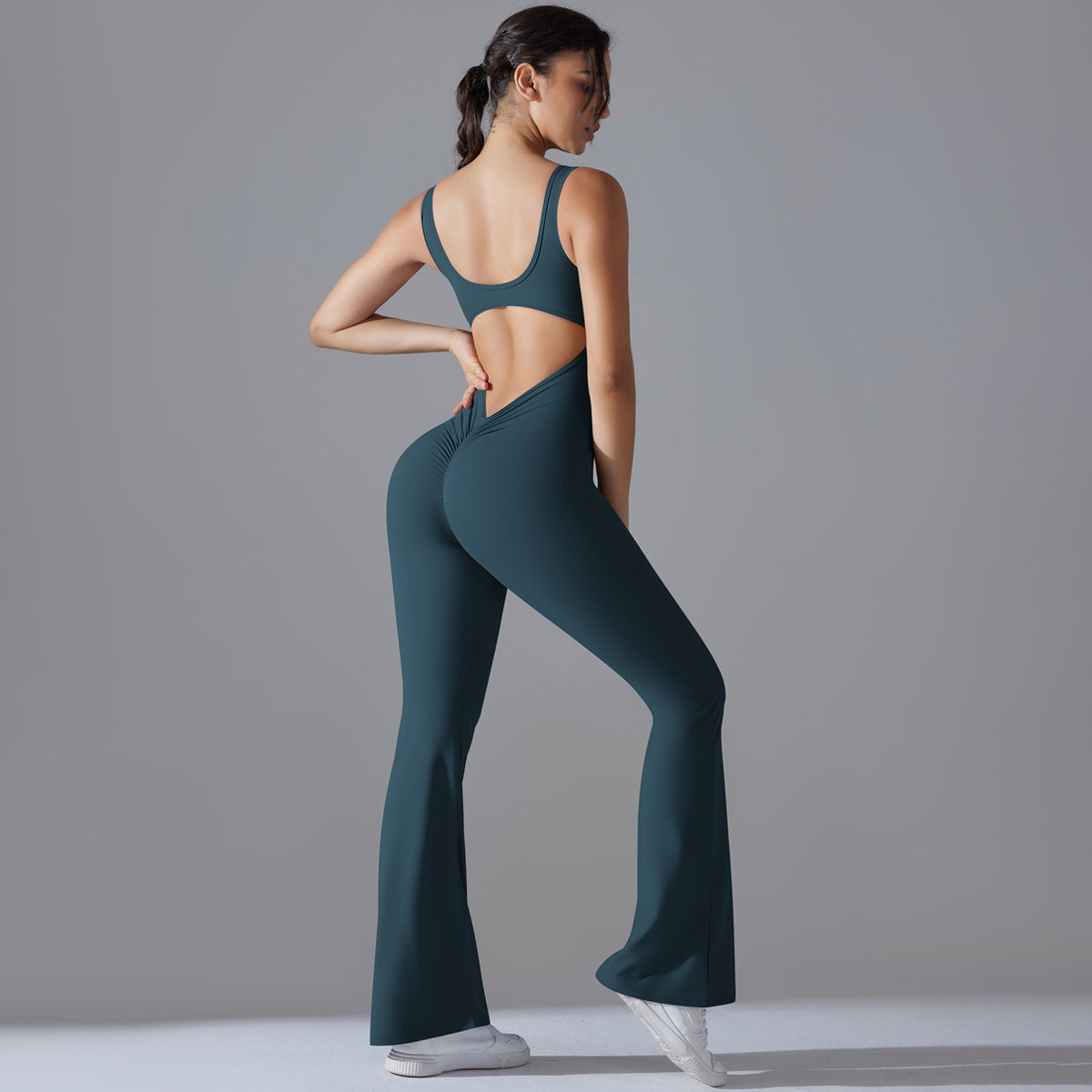 Beautiful Hollow Back Bodysuit for Women Peach Cutting High Waisted Sports Jumpsuit with Flared Pants and Butt Lifting Design for Yoga Gym and Activewear