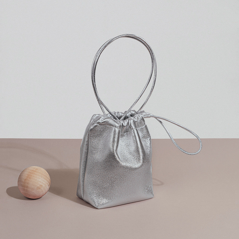 Chic Korean Mini Lambskin Bucket Bag with Soft Pleats and Drawstring Closure Silver Genuine Leather Crossbody Tote for Effortless Everyday Elegance