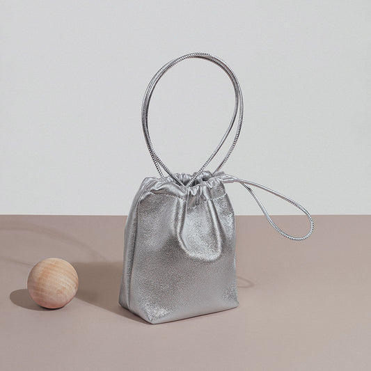 Chic Korean Mini Lambskin Bucket Bag with Soft Pleats and Drawstring Closure Silver Genuine Leather Crossbody Tote for Effortless Everyday Elegance