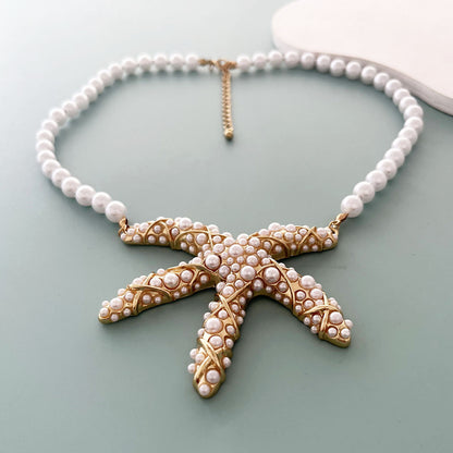 Unique Creative Alloy Starfish Pendant Necklace with Faux Pearl Beads - Perfect for Vacation Style and Summer Fashion