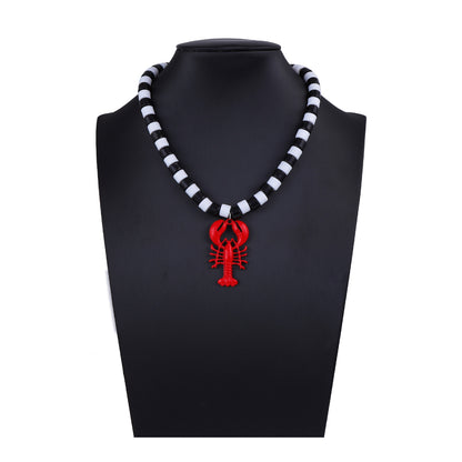 Chic Minimalist Beach-Inspired Alloy Lobster Pendant Necklace for Women - Elegant Black and White Beaded Statement Jewelry