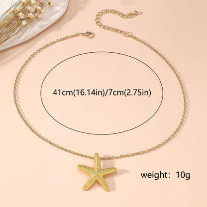 Elegant Gold Star and Pink Fish Necklace - Chic Versatile Jewelry for Every Occasion