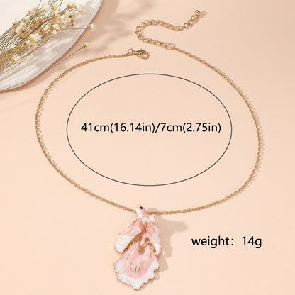 Elegant Gold Star and Pink Fish Necklace - Chic Versatile Jewelry for Every Occasion