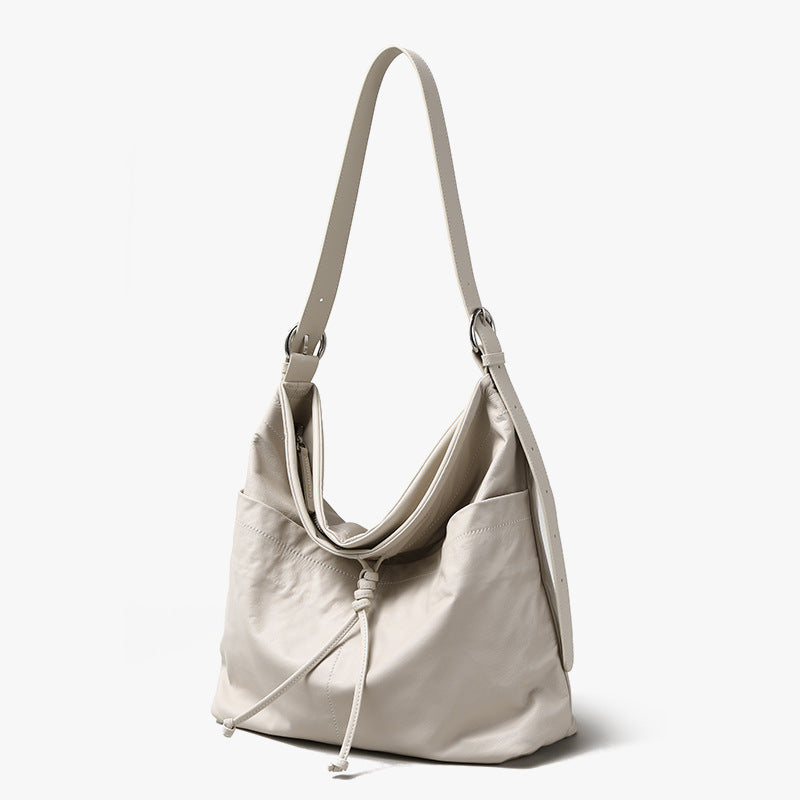 Genuine Leather Women's Tote Bag Luxe Grain Cowhide Shoulder Bag with Bow and Tassel Detail Spacious Commuter Handbag for Everyday Elegance