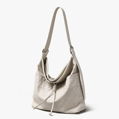 Genuine Leather Women's Tote Bag Luxe Grain Cowhide Shoulder Bag with Bow and Tassel Detail Spacious Commuter Handbag for Everyday Elegance