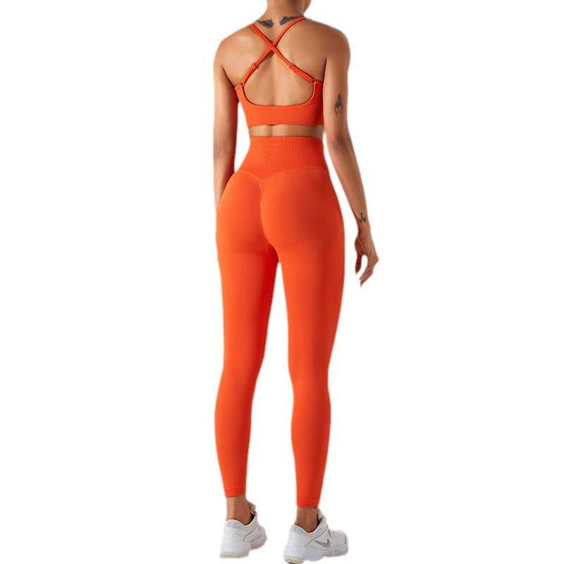 Seamless Women's Yoga Set with Cross Back Sports Bra and Peach Enhancing Quick Dry Yoga Pants Comfort and Style for Active Lifestyles