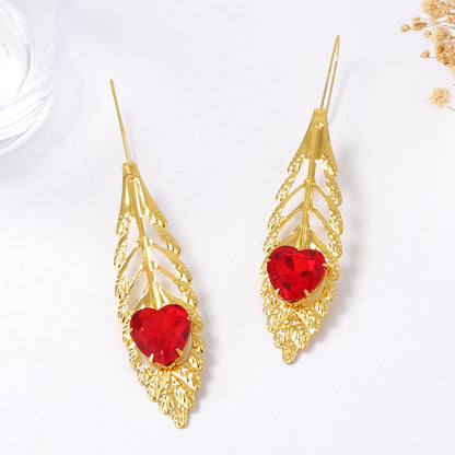 Luxurious Vintage-Inspired Statement Earrings with Intricate Metal Filigree and Exaggerated Feather Leaf Design – Perfect for Glamorous Parties and Special Occasions