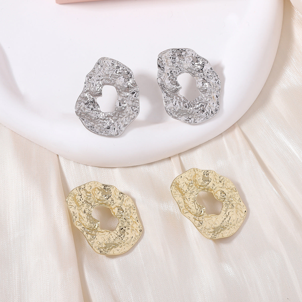 Stylish Geometric Irregular Oval Metal Earrings with Unique Hollowed Round Design — Eye-Catching Textured Studs for a Chic Look