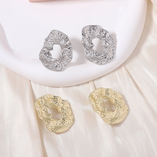 Stylish Geometric Irregular Oval Metal Earrings with Unique Hollowed Round Design — Eye-Catching Textured Studs for a Chic Look