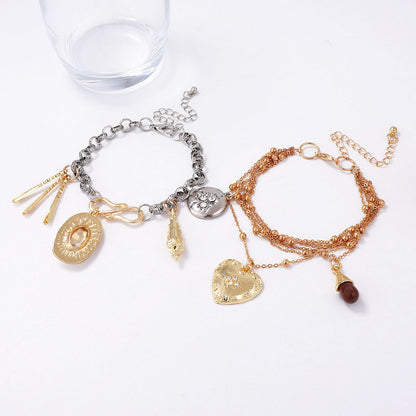 Chic Vintage-Inspired High-End Layered Chain Bracelet with Heart and Geometric Pendant - Perfect for Stacking and Everyday Elegance