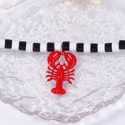 Chic Minimalist Beach-Inspired Alloy Lobster Pendant Necklace for Women - Elegant Black and White Beaded Statement Jewelry