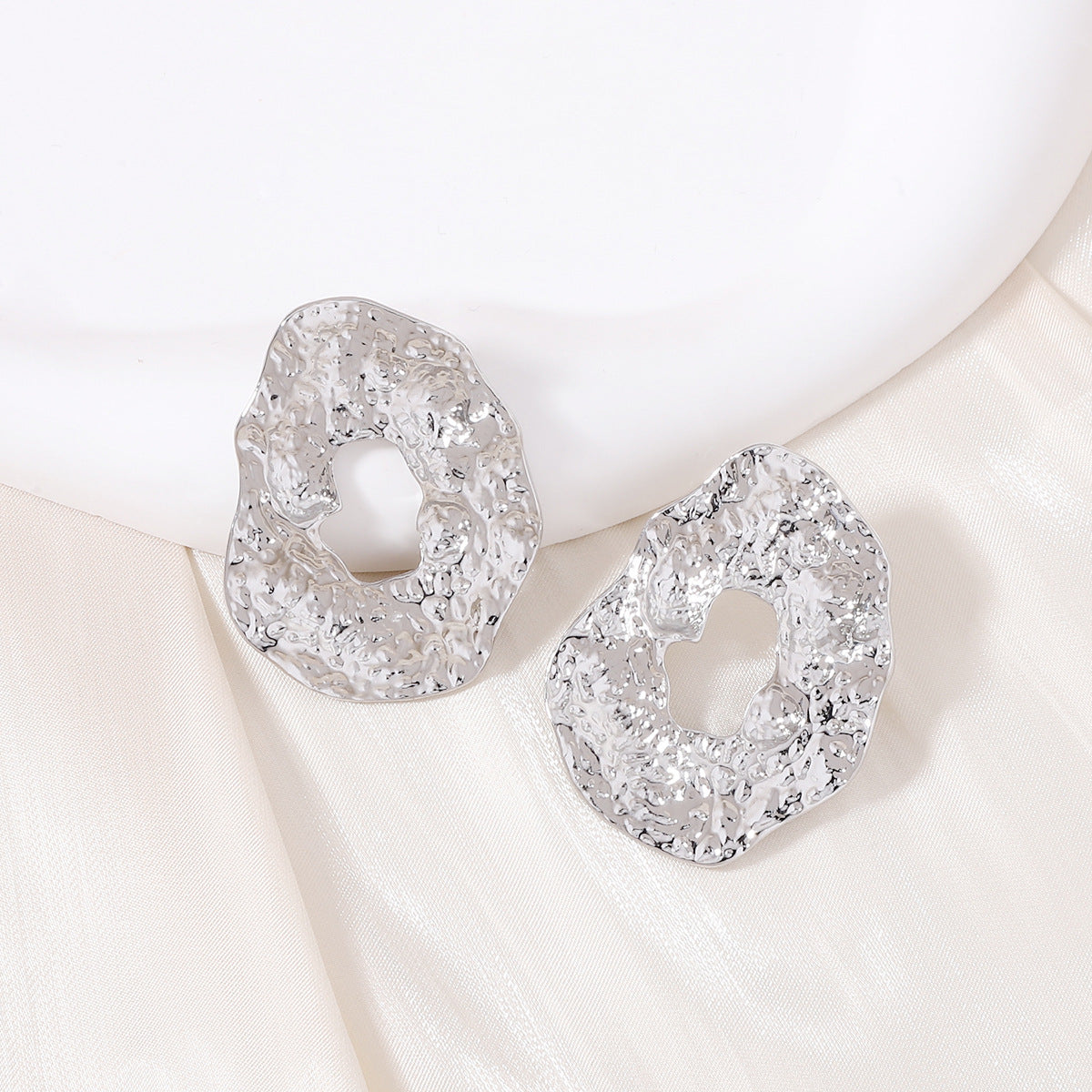 Stylish Geometric Irregular Oval Metal Earrings with Unique Hollowed Round Design — Eye-Catching Textured Studs for a Chic Look