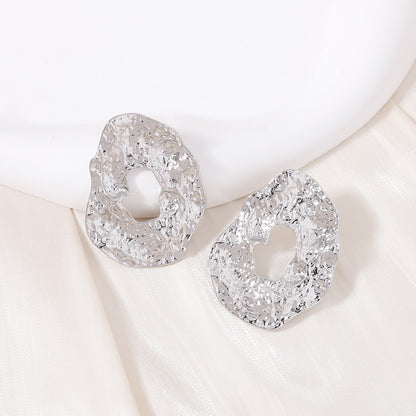 Stylish Geometric Irregular Oval Metal Earrings with Unique Hollowed Round Design — Eye-Catching Textured Studs for a Chic Look