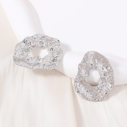 Stylish Geometric Irregular Oval Metal Earrings with Unique Hollowed Round Design — Eye-Catching Textured Studs for a Chic Look
