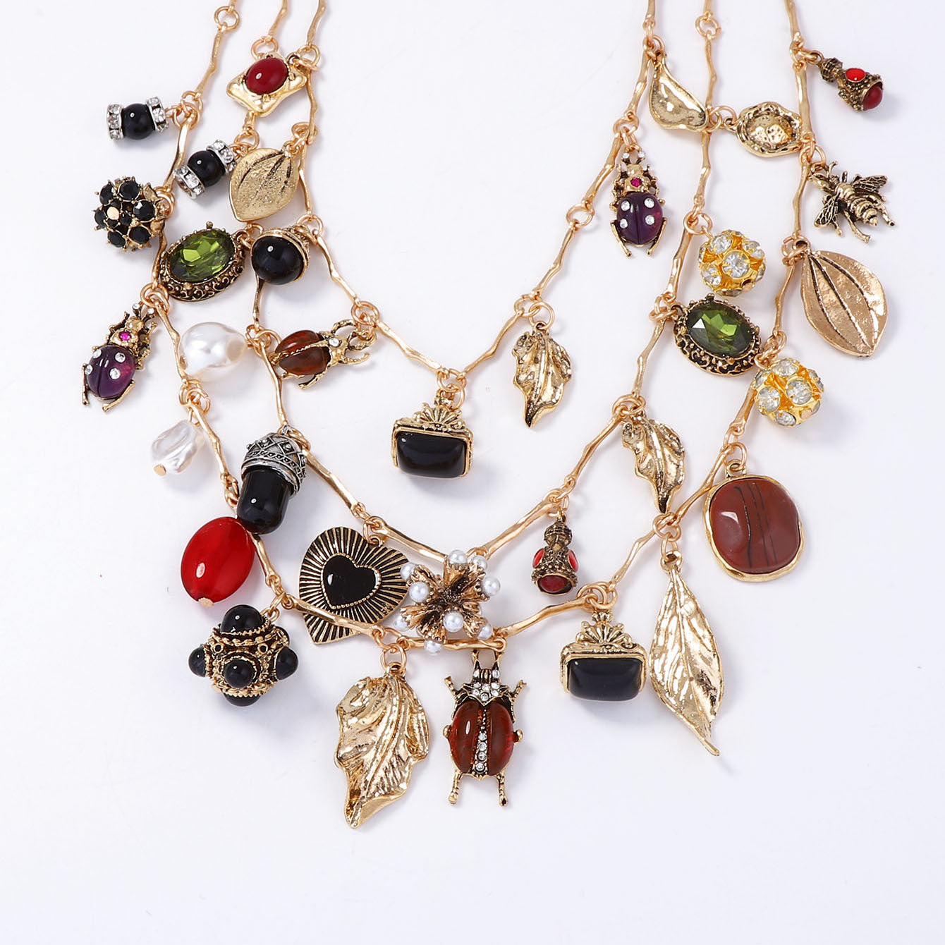 Vintage-Inspired Layered Pendant Necklace Featuring Unique Insect, Leaf, Heart, and Geometric Designs - Perfect for Adding a Touch of Bohemian Charm to Any Outfit