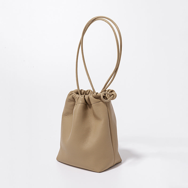 Chic Korean Mini Lambskin Bucket Bag with Soft Pleats and Drawstring Closure Silver Genuine Leather Crossbody Tote for Effortless Everyday Elegance