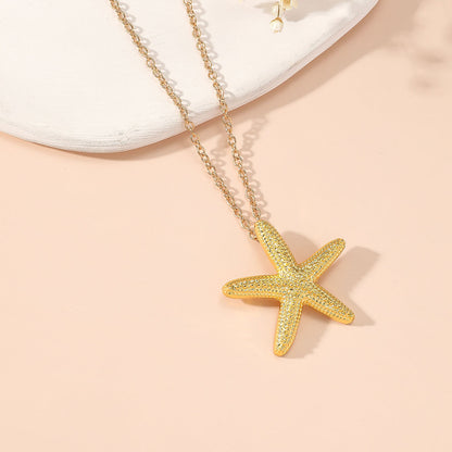 Elegant Gold Star and Pink Fish Necklace - Chic Versatile Jewelry for Every Occasion