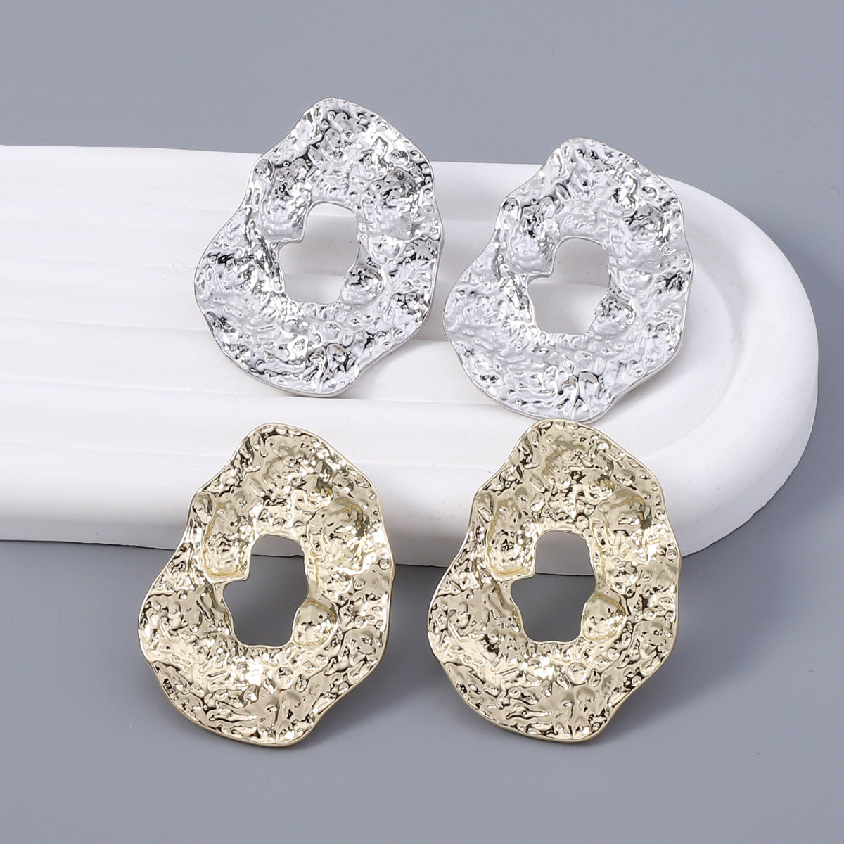 Stylish Geometric Irregular Oval Metal Earrings with Unique Hollowed Round Design — Eye-Catching Textured Studs for a Chic Look