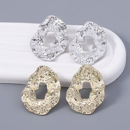 Stylish Geometric Irregular Oval Metal Earrings with Unique Hollowed Round Design — Eye-Catching Textured Studs for a Chic Look