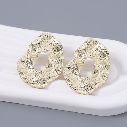 Stylish Geometric Irregular Oval Metal Earrings with Unique Hollowed Round Design — Eye-Catching Textured Studs for a Chic Look