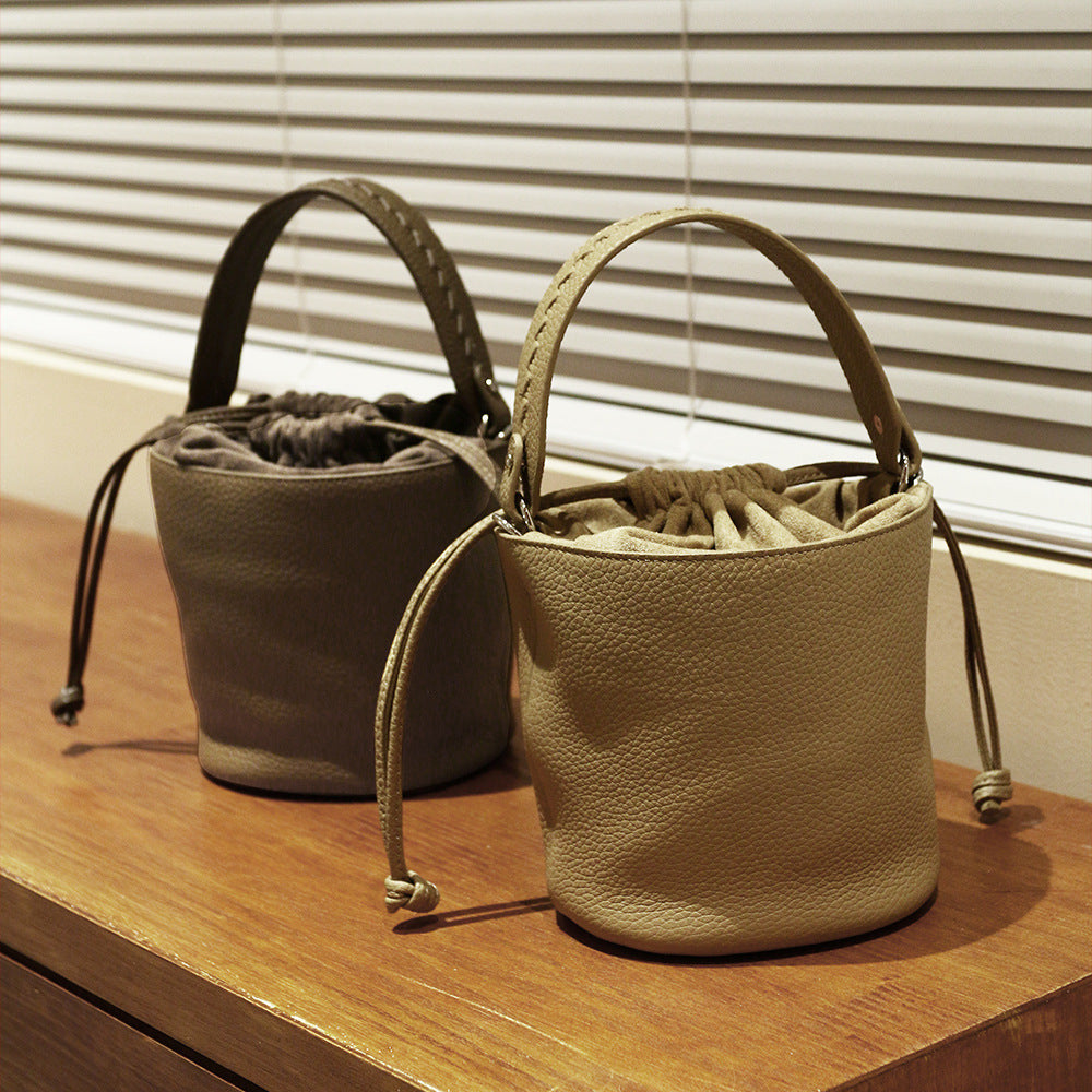 First Layer Cowhide Bucket Bag and Minimalist Design Versatile Handheld Commuter Shoulder Crossbody Bag for Everyday Elegance