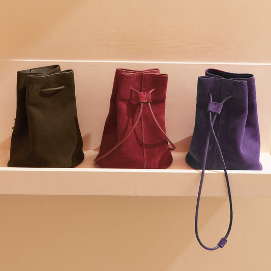 High Gloss Pebbled Cowhide Leather Mini Bucket Bag for Women Chic Vintage Inspired Design for Commute Versatile Shoulder and Handheld Style