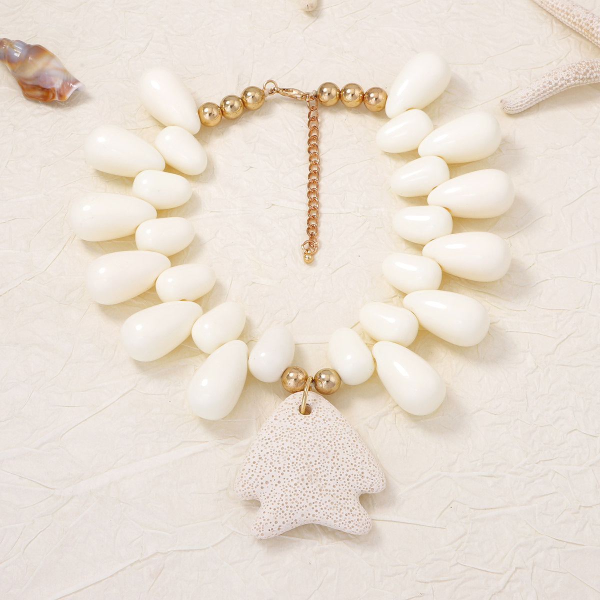 Exquisite Minimalist Natural Ocean-Inspired Vacation Necklace with Volcanic Stone, Starfish, and Tiny Fish Charms - Perfect Summer Accessory for Women