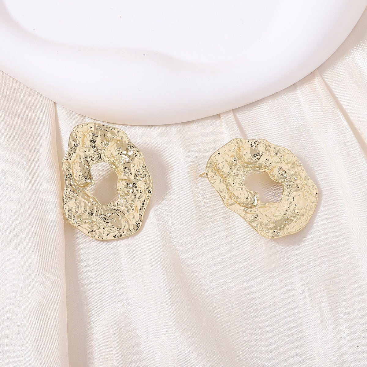 Stylish Geometric Irregular Oval Metal Earrings with Unique Hollowed Round Design — Eye-Catching Textured Studs for a Chic Look