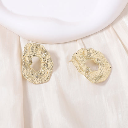 Stylish Geometric Irregular Oval Metal Earrings with Unique Hollowed Round Design — Eye-Catching Textured Studs for a Chic Look