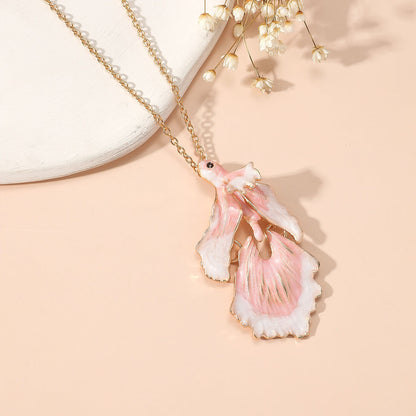 Elegant Gold Star and Pink Fish Necklace - Chic Versatile Jewelry for Every Occasion
