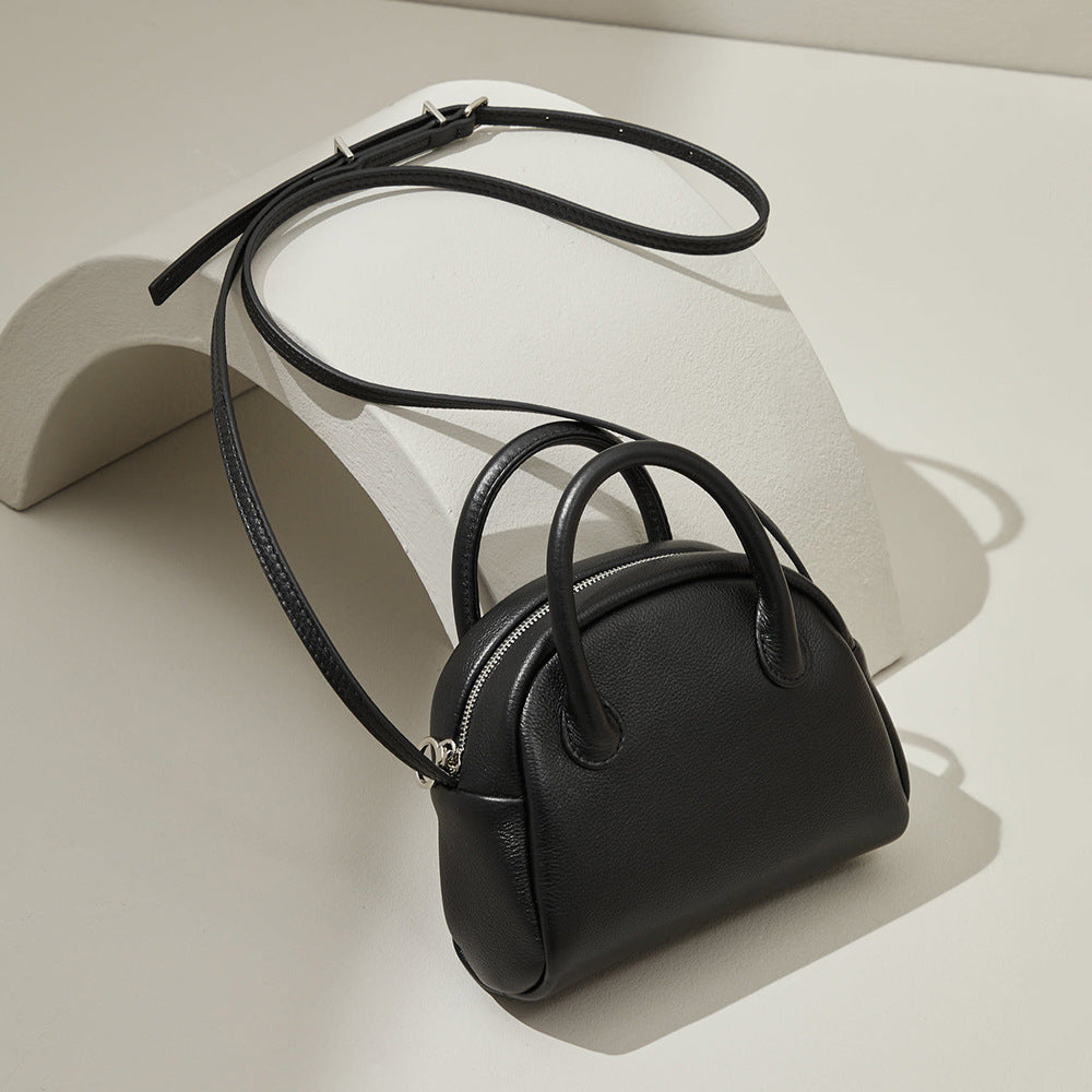 Grain Leather Korean Inspired Bowling Bag Shell Design Versatile Handheld Crossbody Carry Luxurious Genuine Leather Small Purse for Fashion Forward Individuals