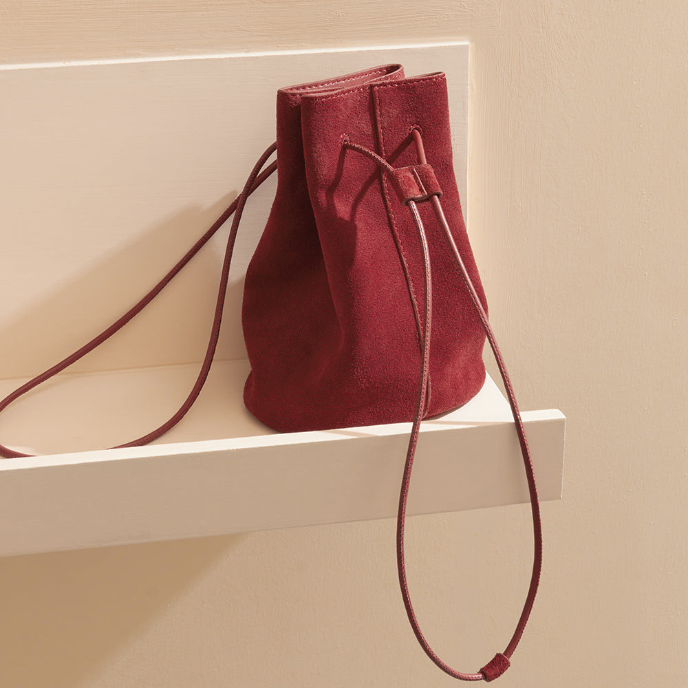 High Gloss Pebbled Cowhide Leather Mini Bucket Bag for Women Chic Vintage Inspired Design for Commute Versatile Shoulder and Handheld Style