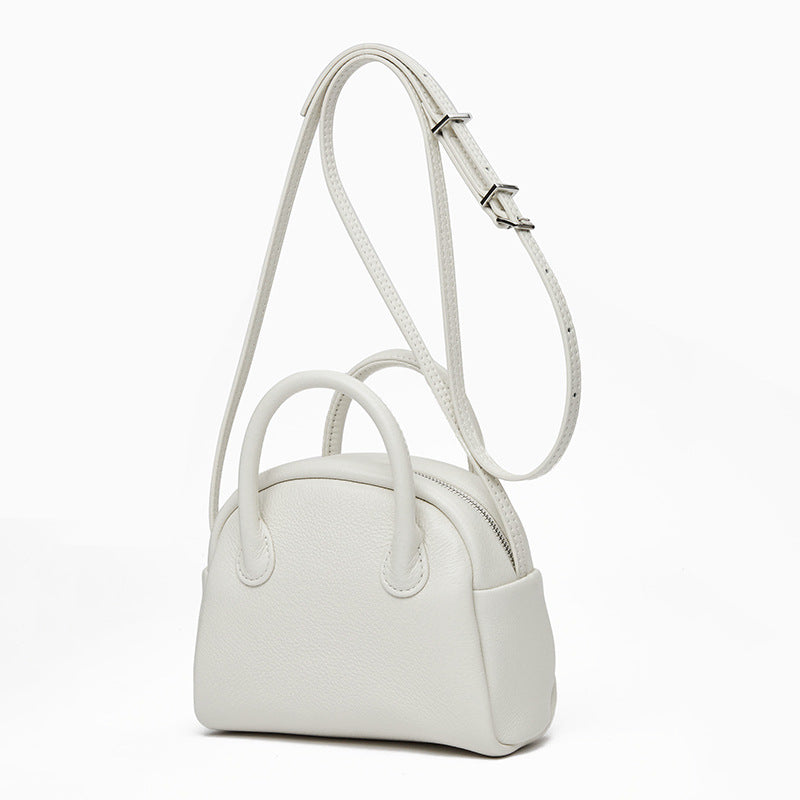 Grain Leather Korean Inspired Bowling Bag Shell Design Versatile Handheld Crossbody Carry Luxurious Genuine Leather Small Purse for Fashion Forward Individuals