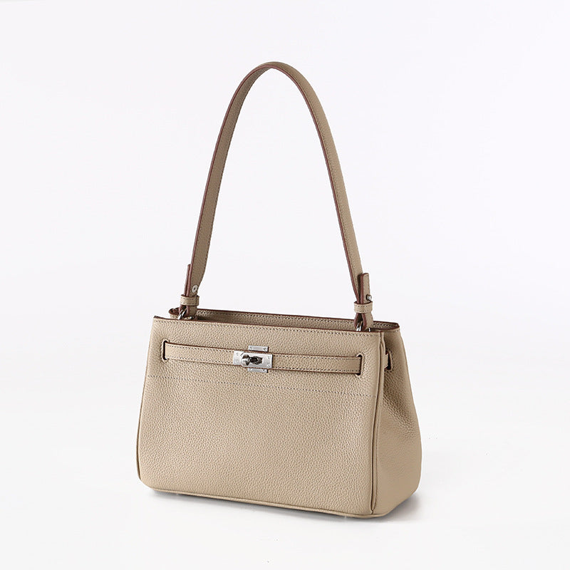 Luxurious Vintage Style Leather Tote Bag with Lock Closure Cowhide for Chic Commuting and Versatile Carrying Options