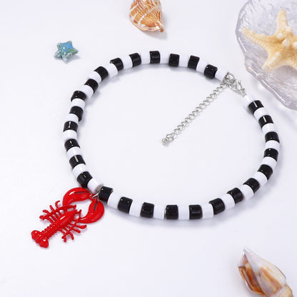Chic Minimalist Beach-Inspired Alloy Lobster Pendant Necklace for Women - Elegant Black and White Beaded Statement Jewelry