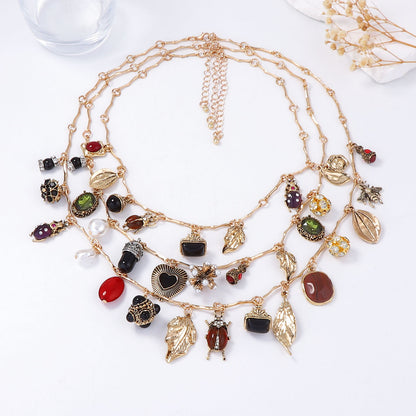 Vintage-Inspired Layered Pendant Necklace Featuring Unique Insect, Leaf, Heart, and Geometric Designs - Perfect for Adding a Touch of Bohemian Charm to Any Outfit