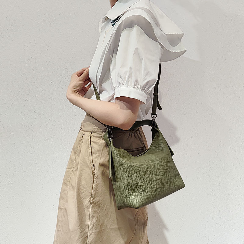 Versatile Bucket Bag Chic Korean Style Crossbody Handbag in Litchi Leather Featuring Magnetic Snap Closure Genuine Leather Tote for Everyday Commuting