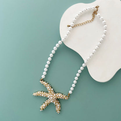 Unique Creative Alloy Starfish Pendant Necklace with Faux Pearl Beads - Perfect for Vacation Style and Summer Fashion